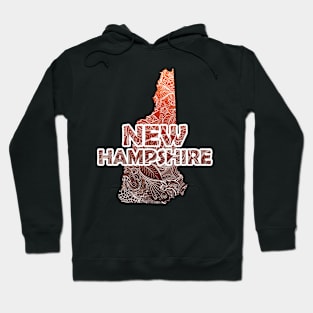 Colorful mandala art map of New Hampshire with text in brown and orange Hoodie